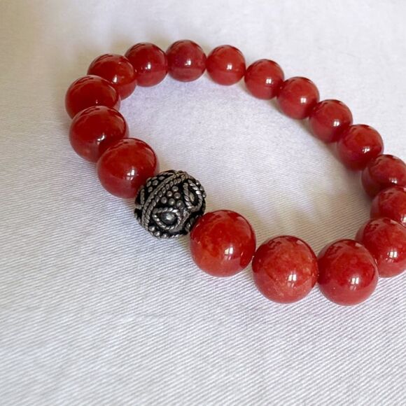 10mm rust jade stretch bracelet with 11mm Tibetan silver spacer. - Picture 2 of 4